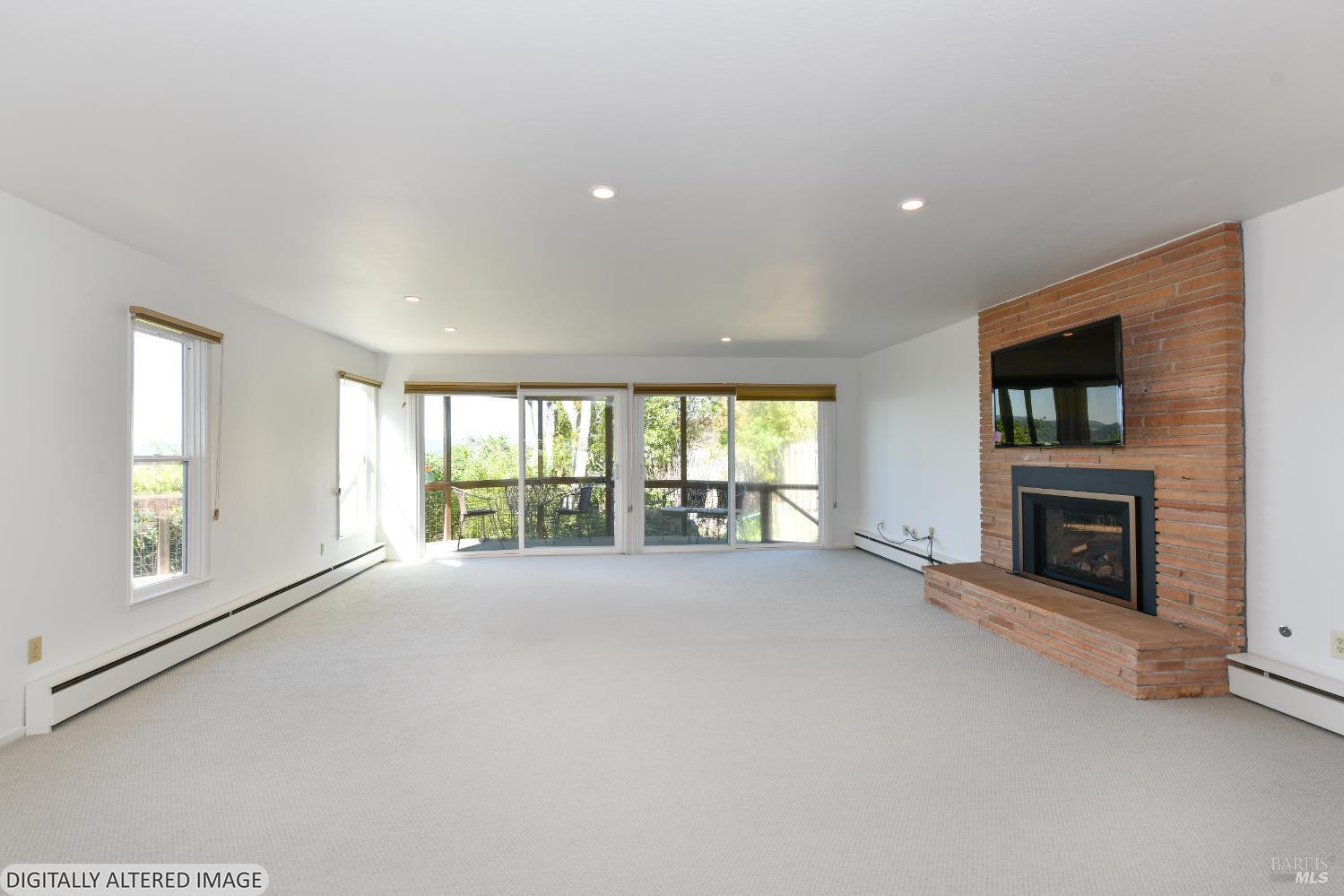 22 Monez Boulevard Napa, CA 94559 - Photo 6 of 30 a view of an empty room with a fireplace and a window