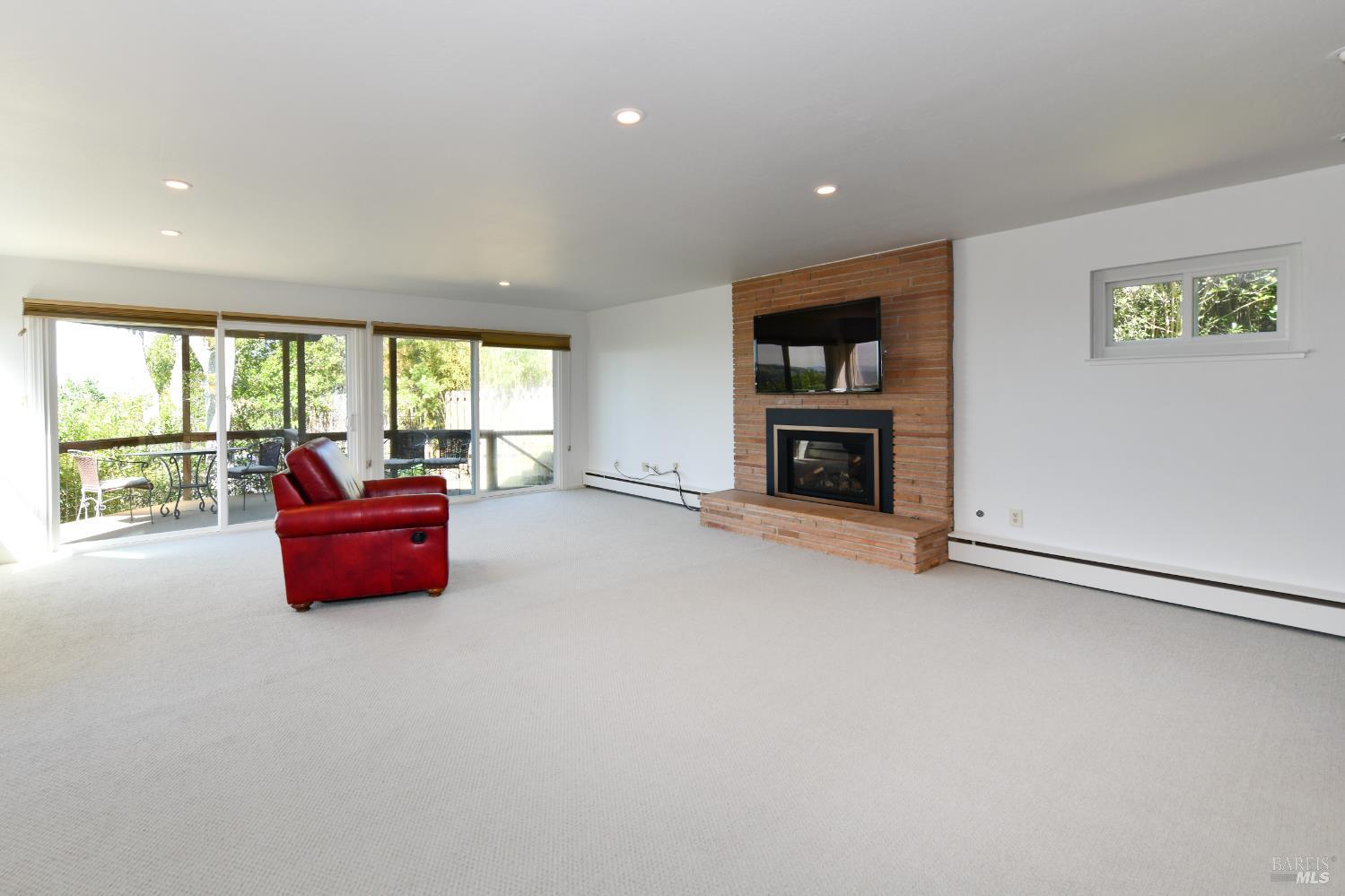 22 Monez Boulevard Napa, CA 94559 - Photo 7 of 30 an empty room with furniture and a fireplace