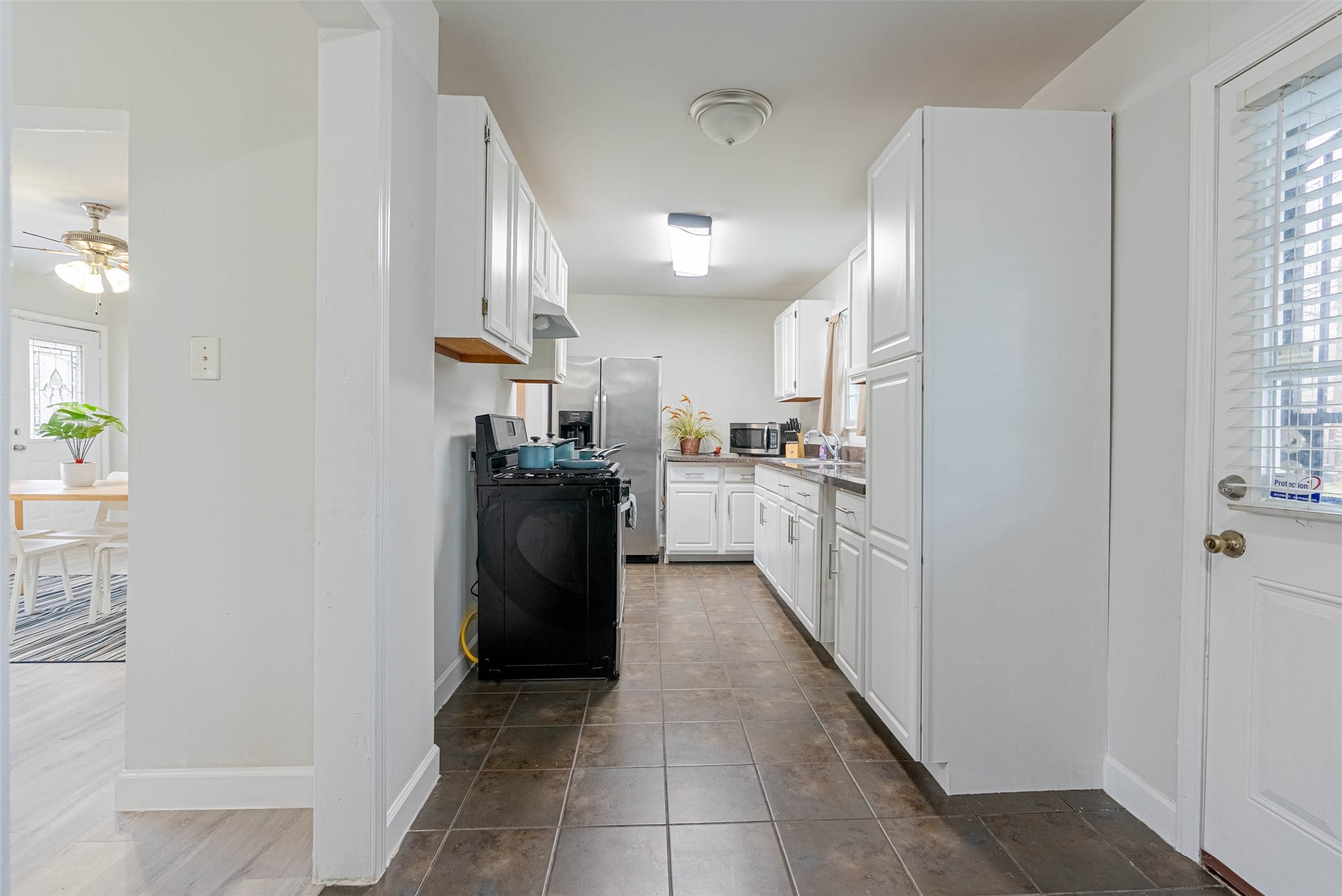 3910 Luca Street Houston, TX 77021 - Photo 12 of 29 a kitchen with stainless steel appliances granite countertop a refrigerator and a sink