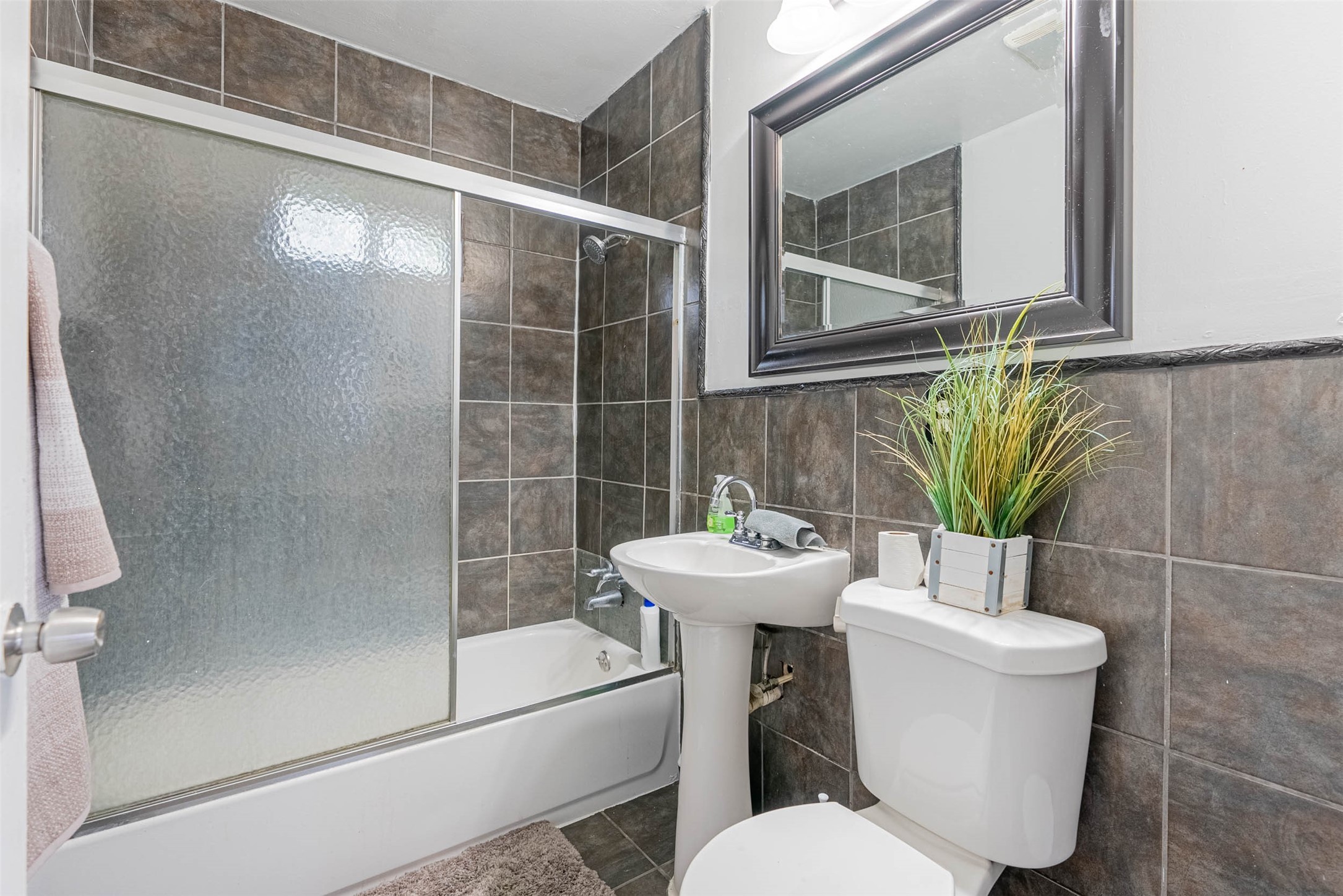 3910 Luca Street Houston, TX 77021 - Photo 17 of 29 a white toilet sitting next to a bathroom sink
