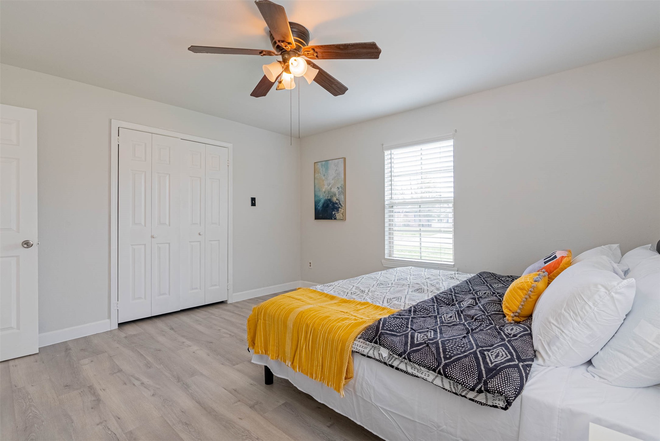 3910 Luca Street Houston, TX 77021 - Photo 20 of 29 a bedroom with a bed and a chandelier