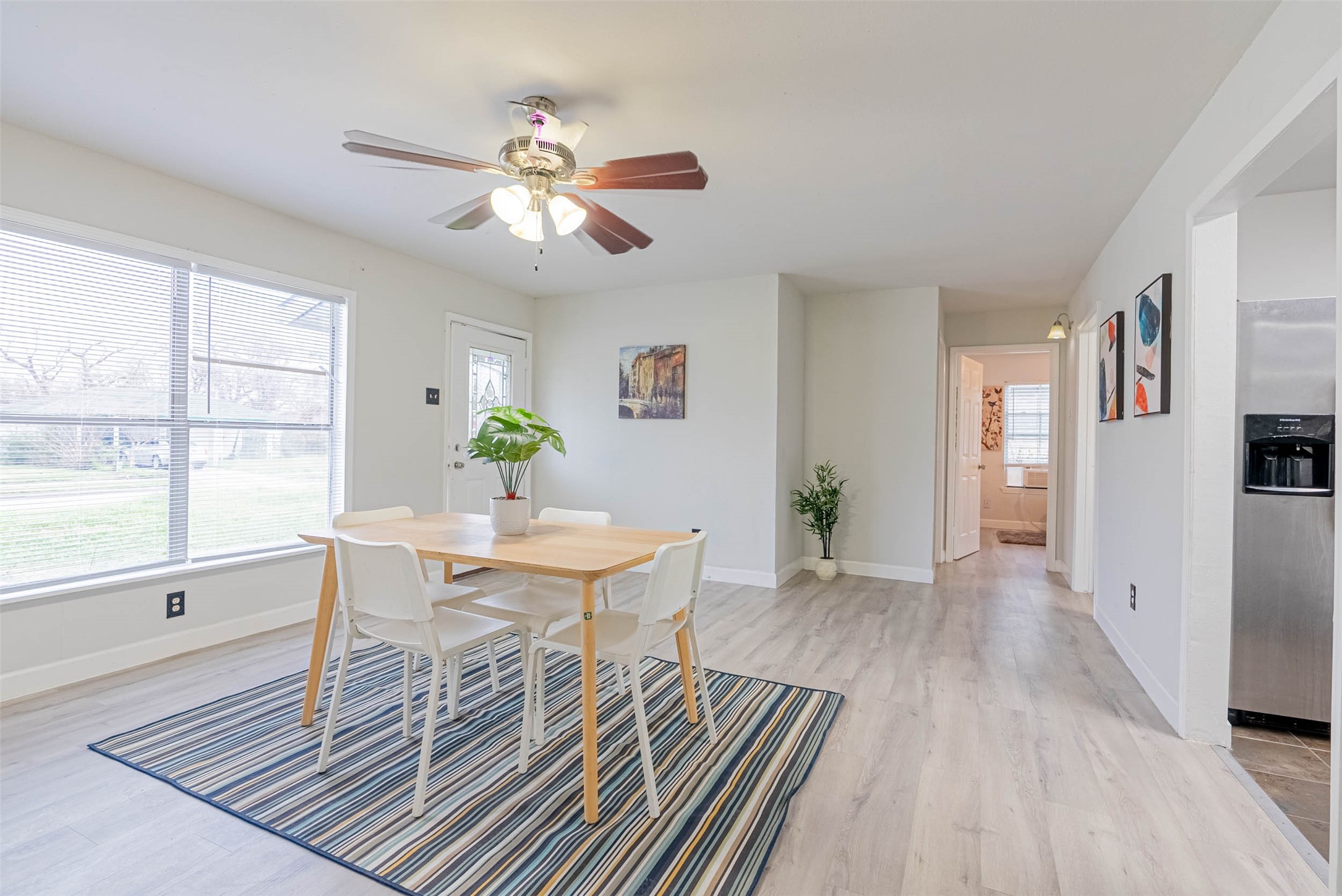 3910 Luca Street Houston, TX 77021 - Photo 3 of 29 a view of a dining room with furniture window and wooden floor