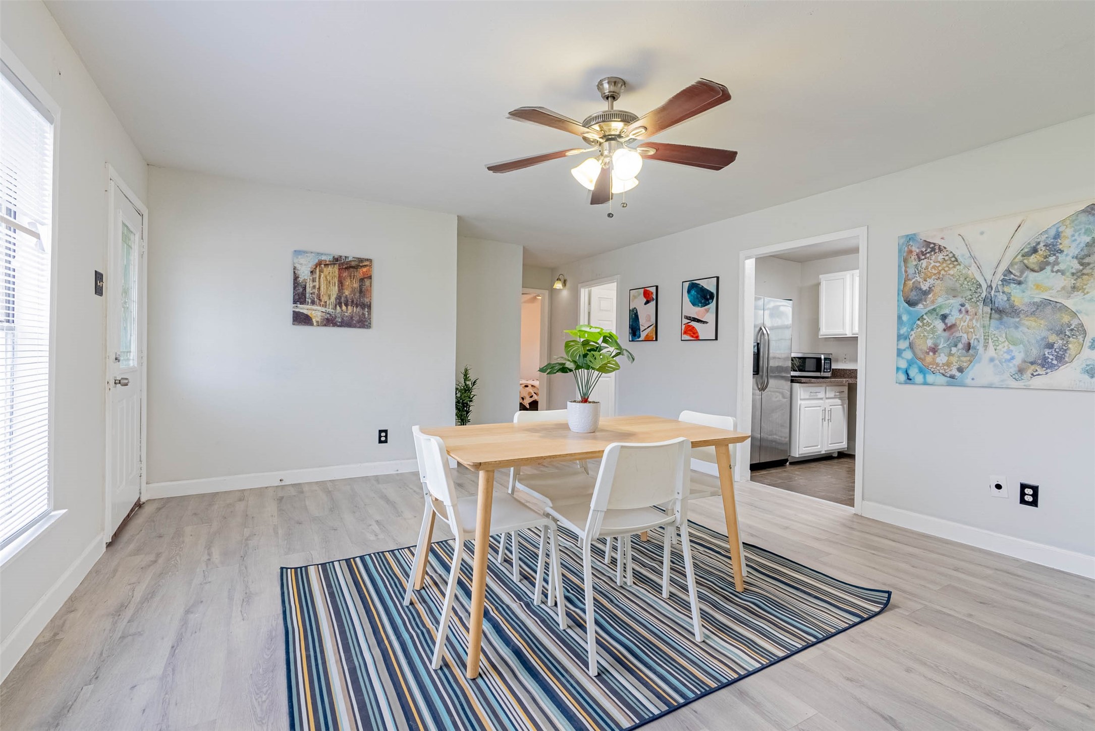 3910 Luca Street Houston, TX 77021 - Photo 5 of 29 a view of a dining room with furniture and wooden floor