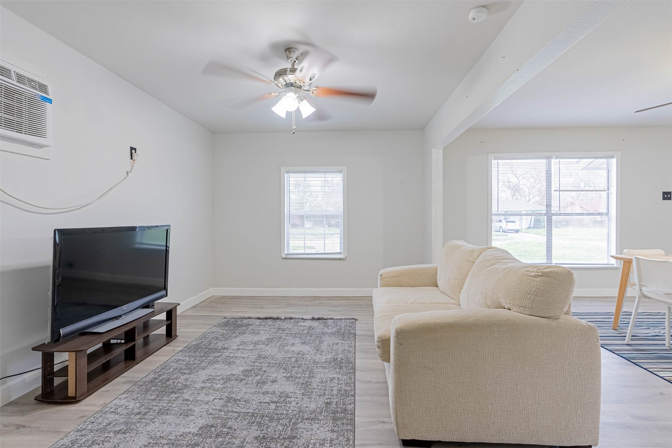 3910 Luca Street Houston, TX 77021 - Photo 10 of 29 a living room with furniture and a flat screen tv