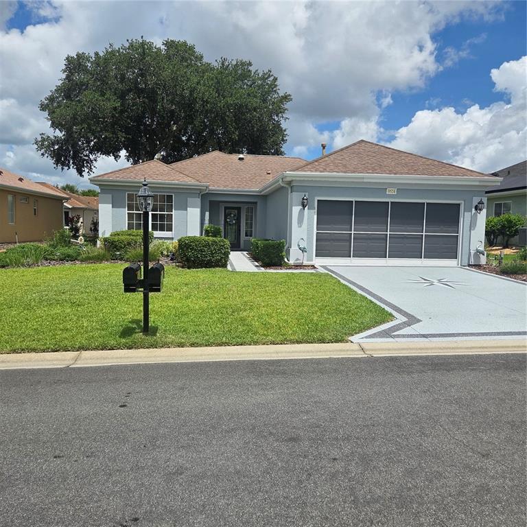 9524 Southeast 124th Loop Summerfield, FL 34491 - Photo 1 of 33 a front view of a house with a yard and potted plants