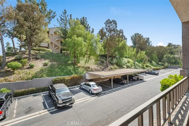 a view of a balcony with chairs
