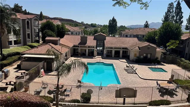 an aerial view of a house with garden space and street view