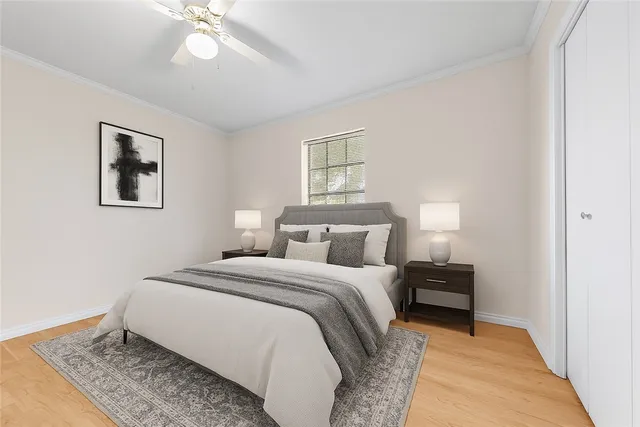 a bedroom with bed and a night stand