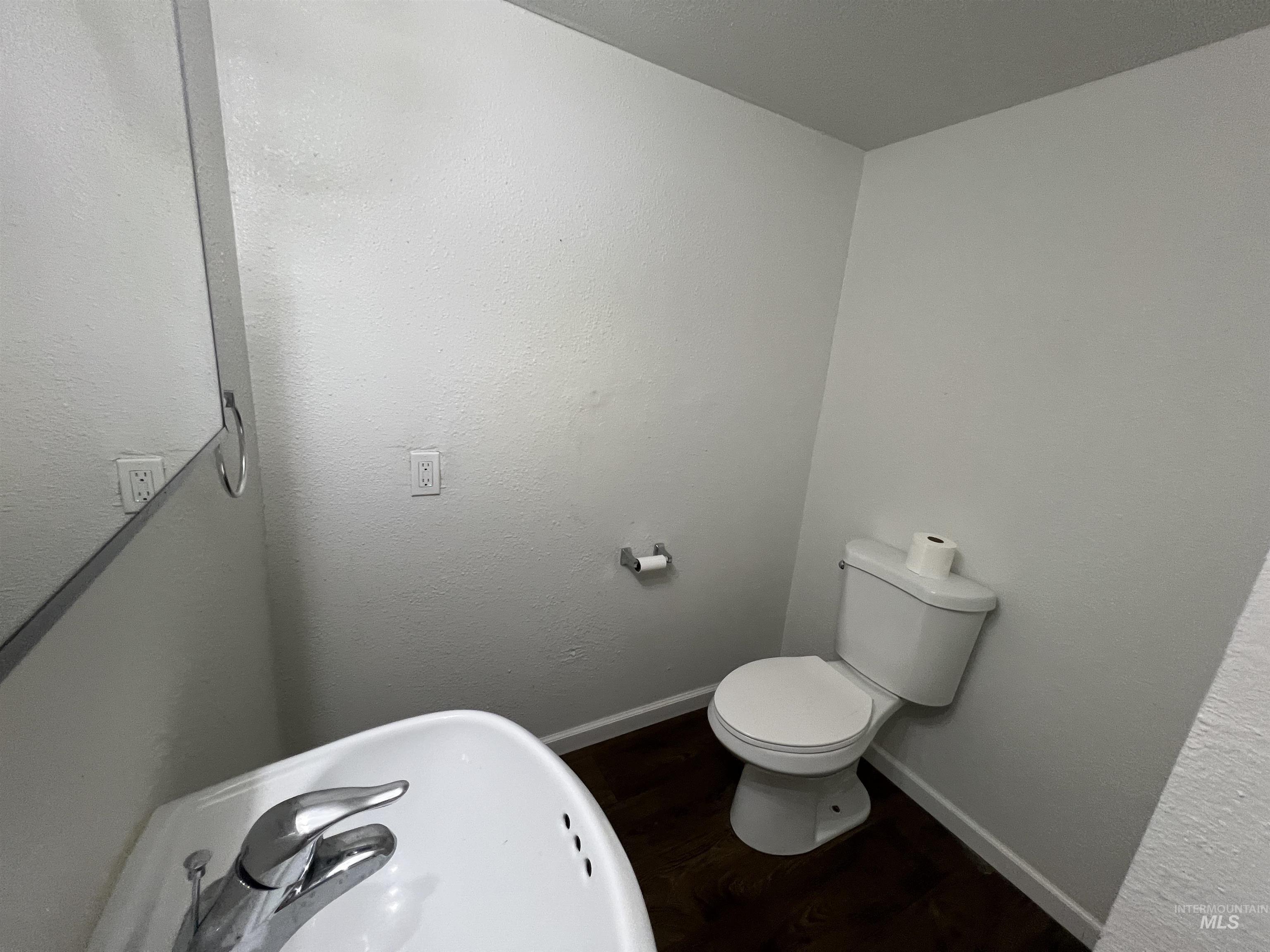 151 Northwest 8th Street Ontario, OR 97914 - Photo 16 of 30 Half bathroom with dark wood-type flooring and a textured wall