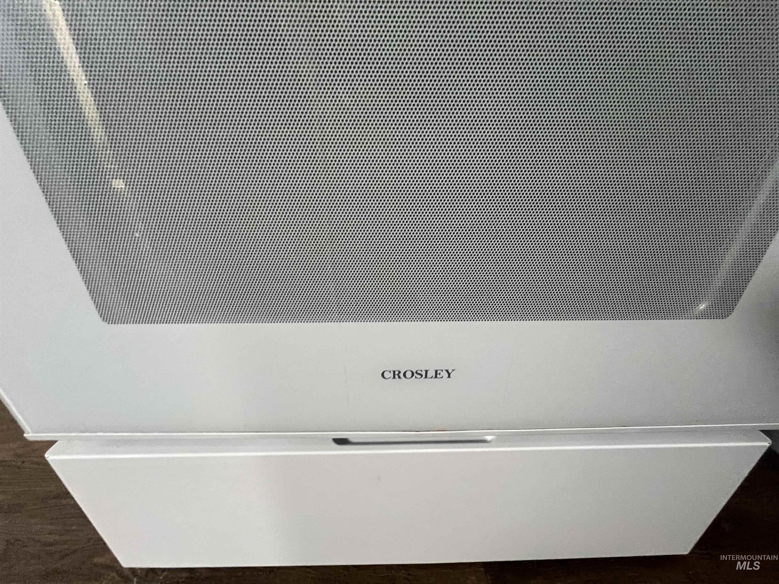 151 Northwest 8th Street Ontario, OR 97914 - Photo 9 of 30 Detailed view of an AC wall unit and wood finished floors