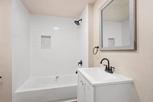 a bathroom with a sink and a bathtub