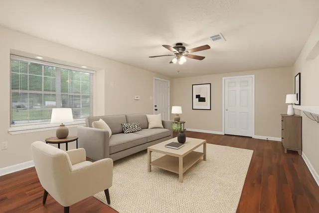 a living room with furniture and a large window