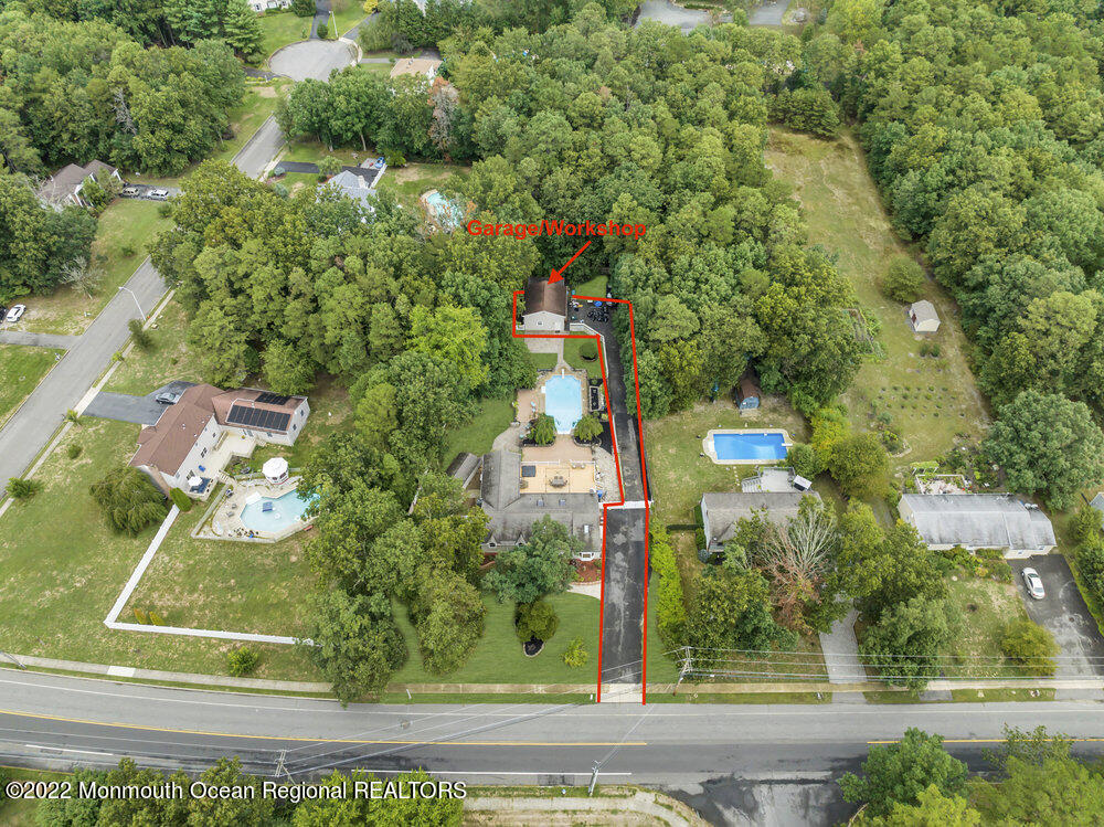 722 Anderson Road Jackson, NJ 08527 - Photo 54 of 80 an aerial view of a house with a yard and garden
