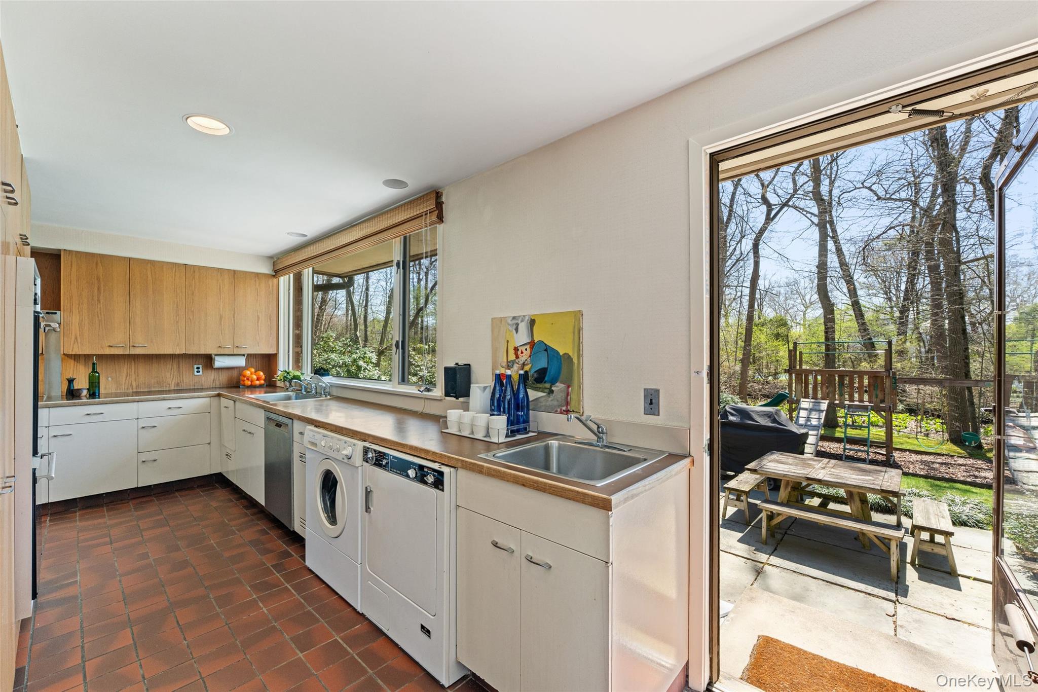 98 Cushman Road Scarsdale, NY 10583 - Photo 16 of 43 Beautiful views of the backyard from kitchen