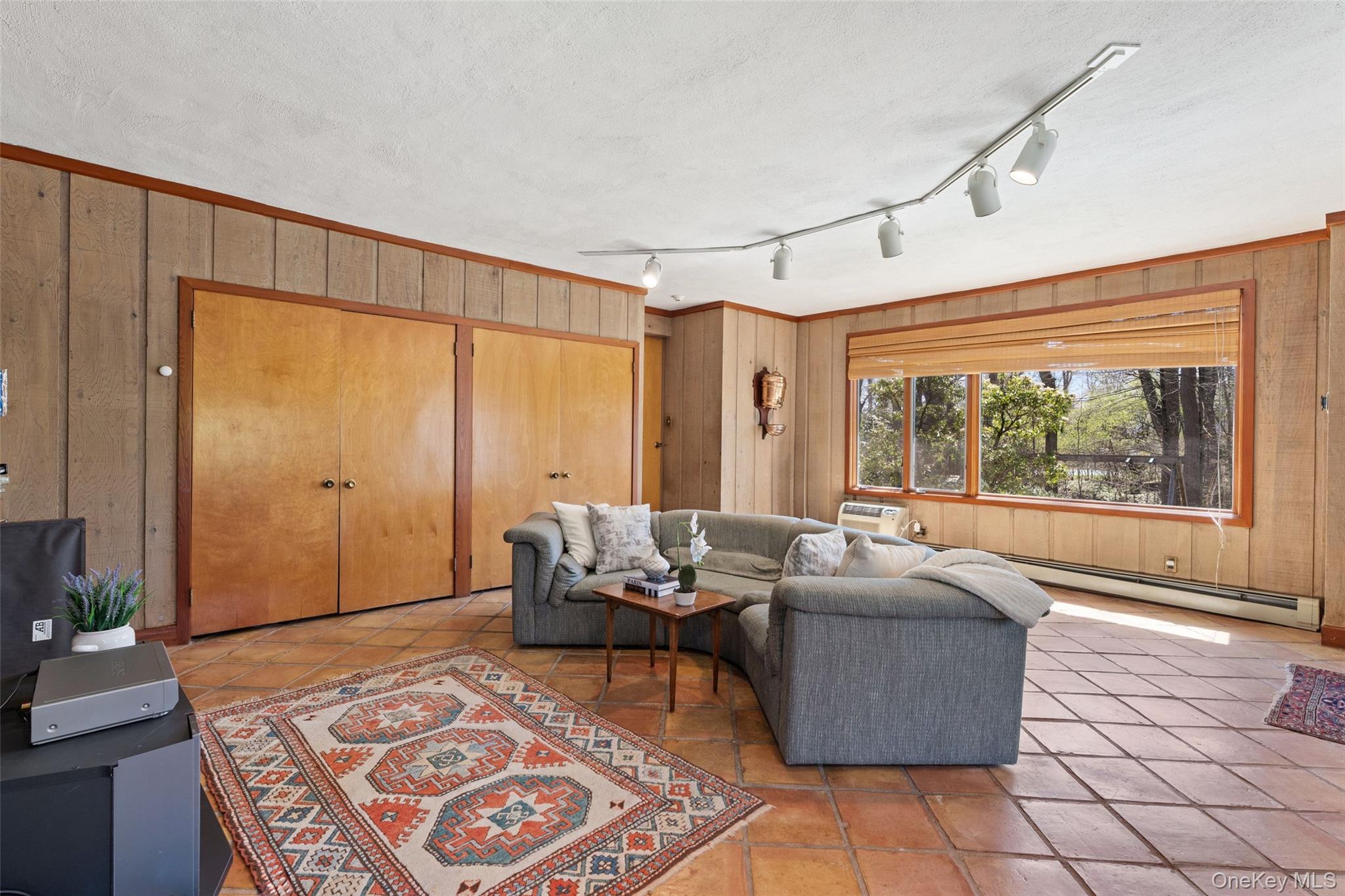 98 Cushman Road Scarsdale, NY 10583 - Photo 30 of 43 Family room off kitchen with door to access the 2 car garage