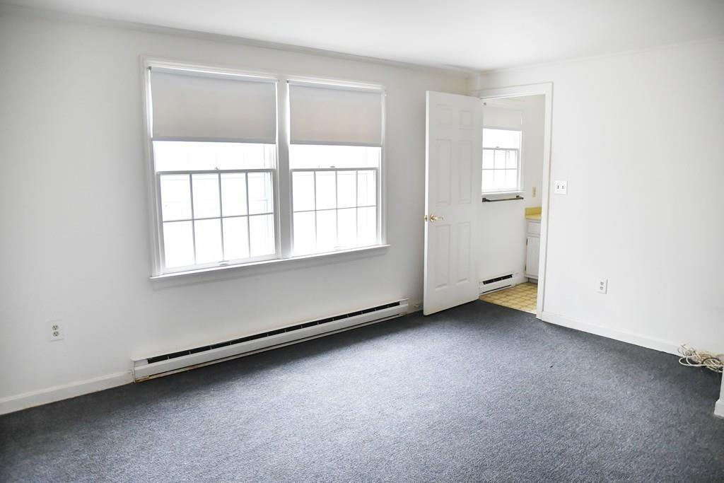 45 Powder Mill Road Sudbury, MA 01776 - Photo 12 of 20 an empty room with windows