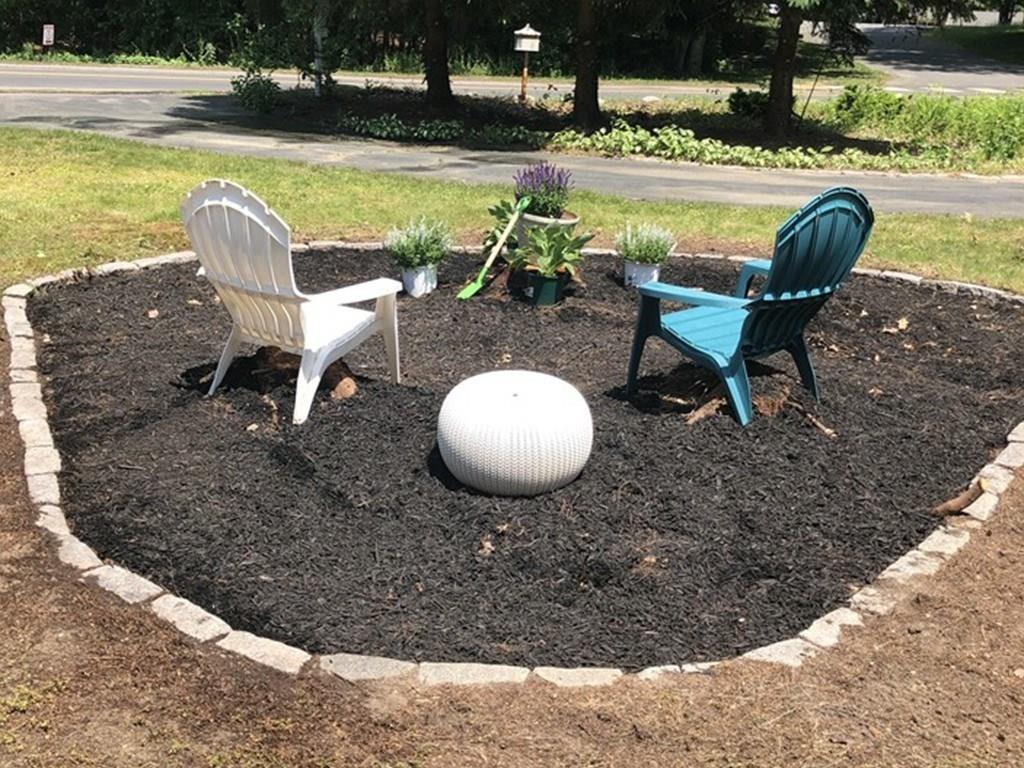 45 Powder Mill Road Sudbury, MA 01776 - Photo 3 of 20 a view of a swimming pool from a lake view