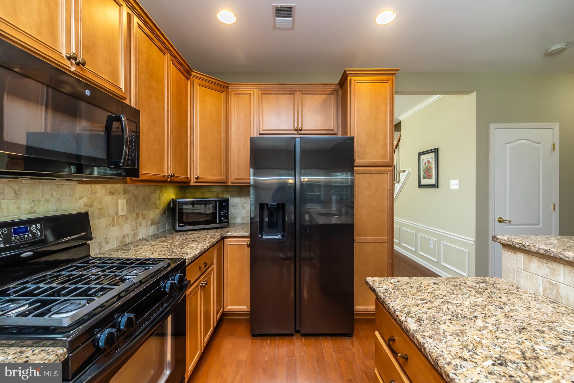 141 Stoyer Road Coatesville, PA 19320 - Photo 13 of 40 a kitchen with a refrigerator stove and oven