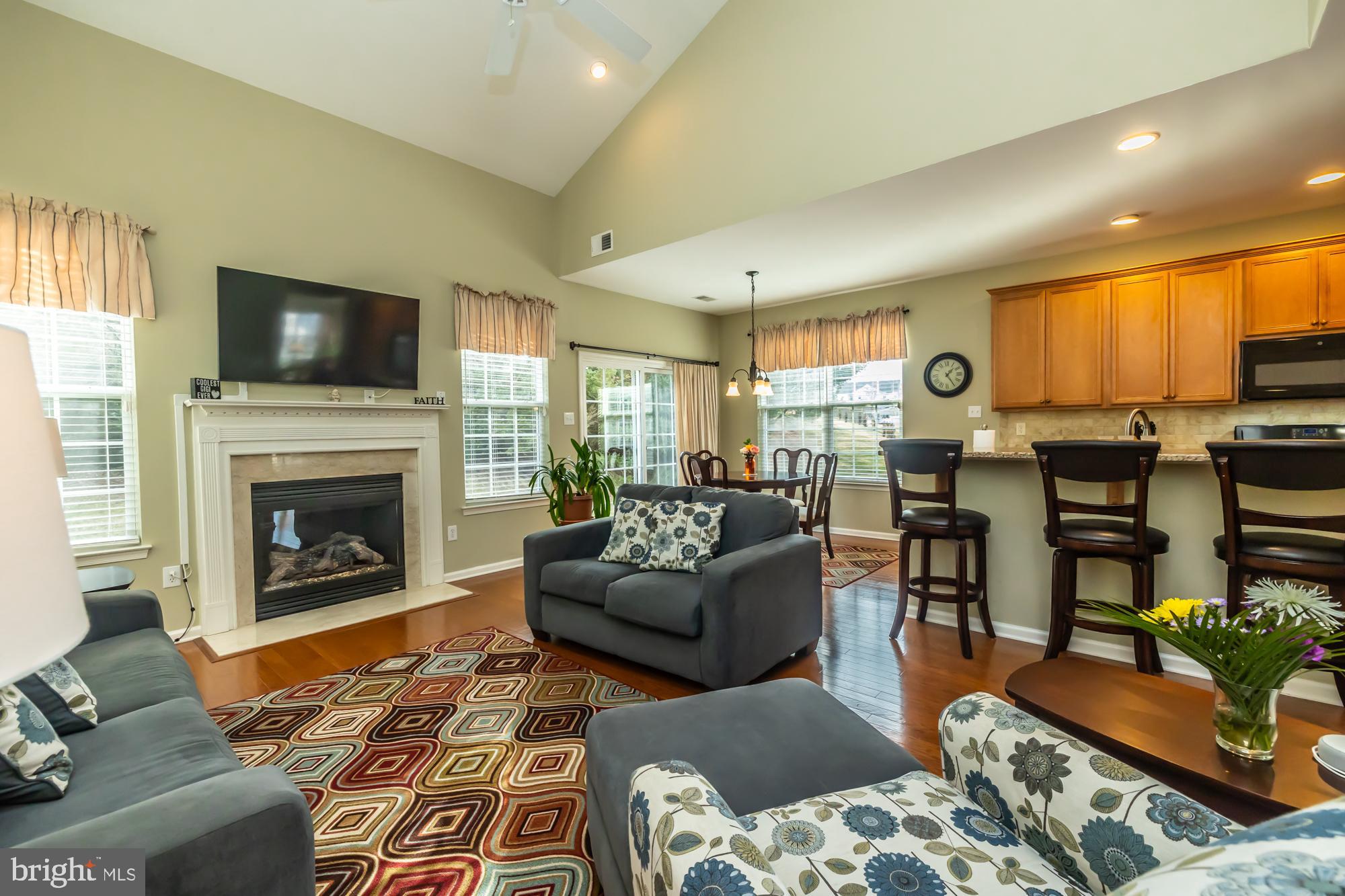 141 Stoyer Road Coatesville, PA 19320 - Photo 19 of 40 a living room with furniture a flat screen tv and a fireplace