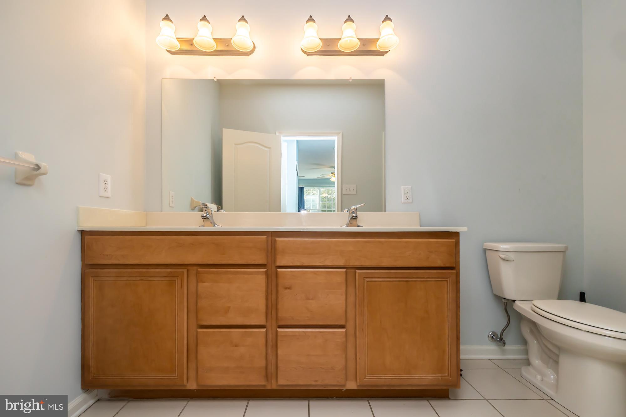 141 Stoyer Road Coatesville, PA 19320 - Photo 26 of 40 a bathroom with a sink vanity mirror and toilet