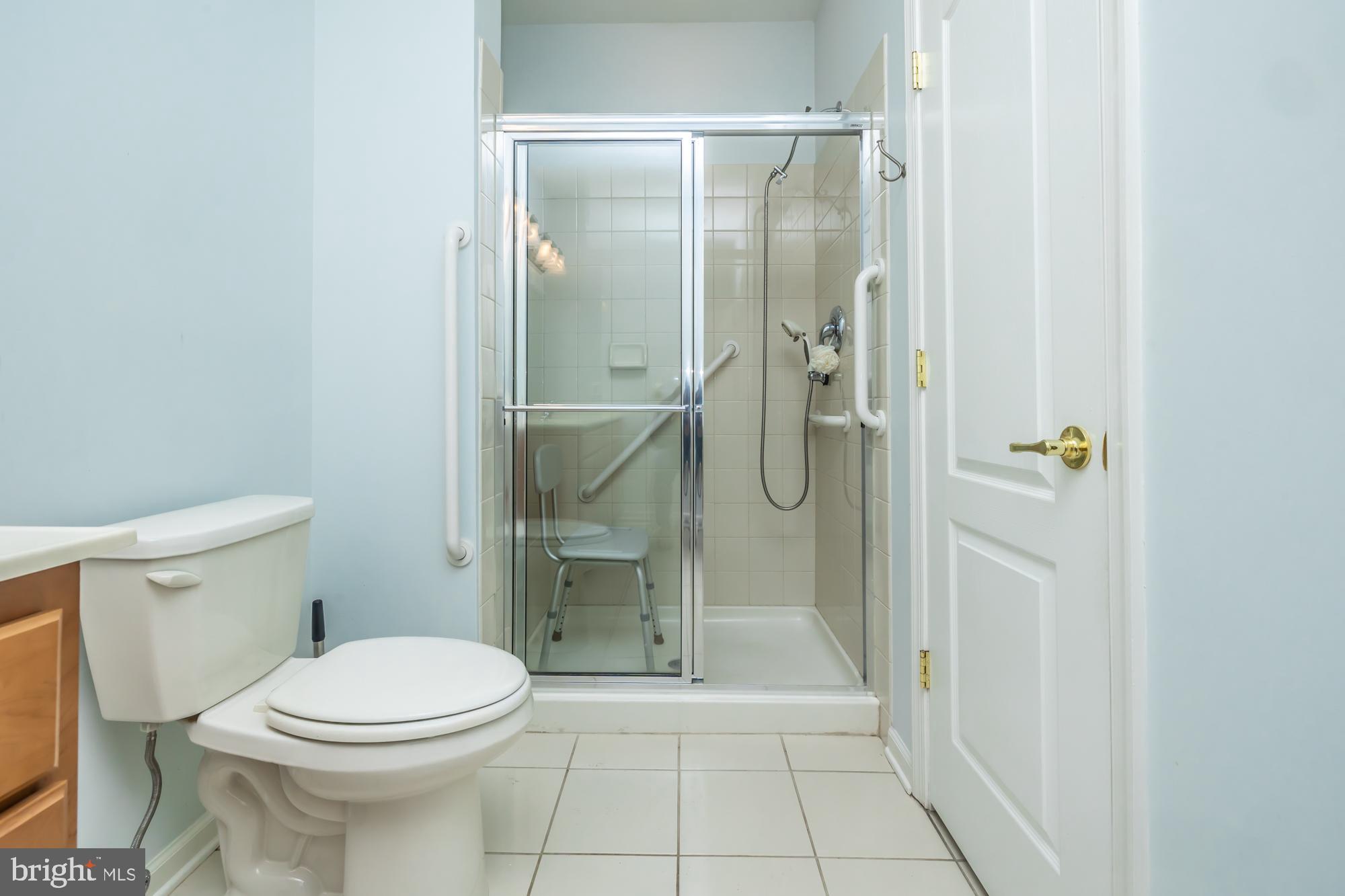 141 Stoyer Road Coatesville, PA 19320 - Photo 27 of 40 a bathroom with a granite countertop toilet and a shower