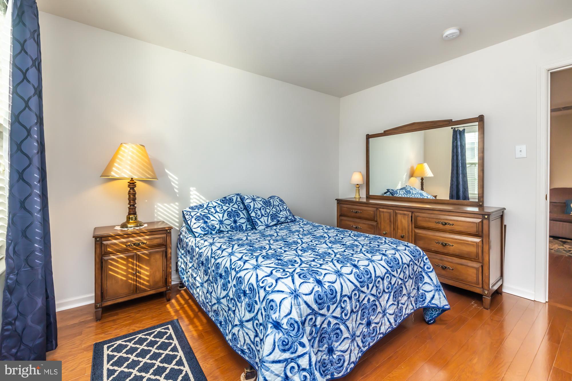 141 Stoyer Road Coatesville, PA 19320 - Photo 29 of 40 a bedroom with a bed and wooden floor