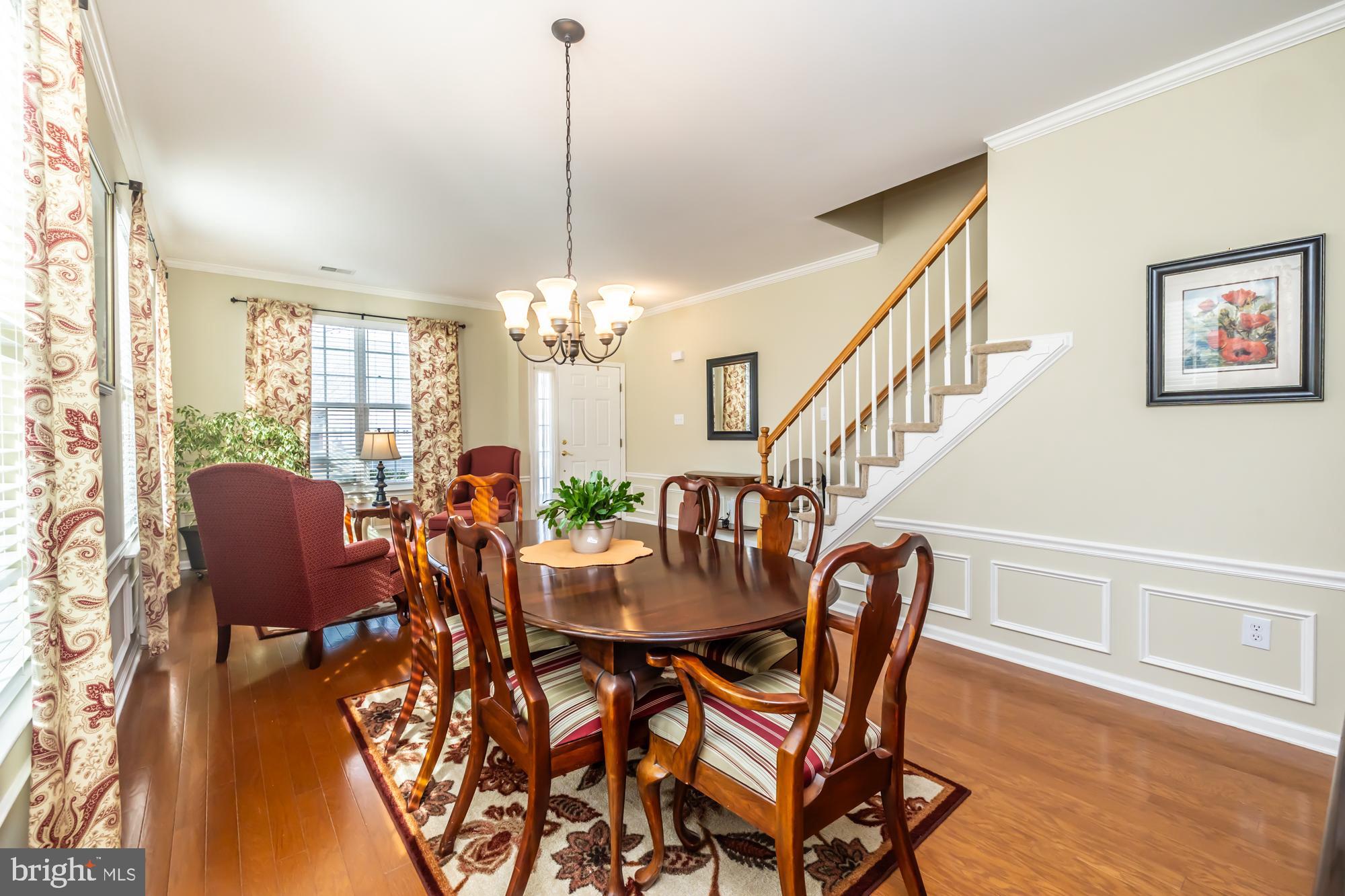 141 Stoyer Road Coatesville, PA 19320 - Photo 8 of 40 a view of a dining room with furniture a chandelier and wooden floor