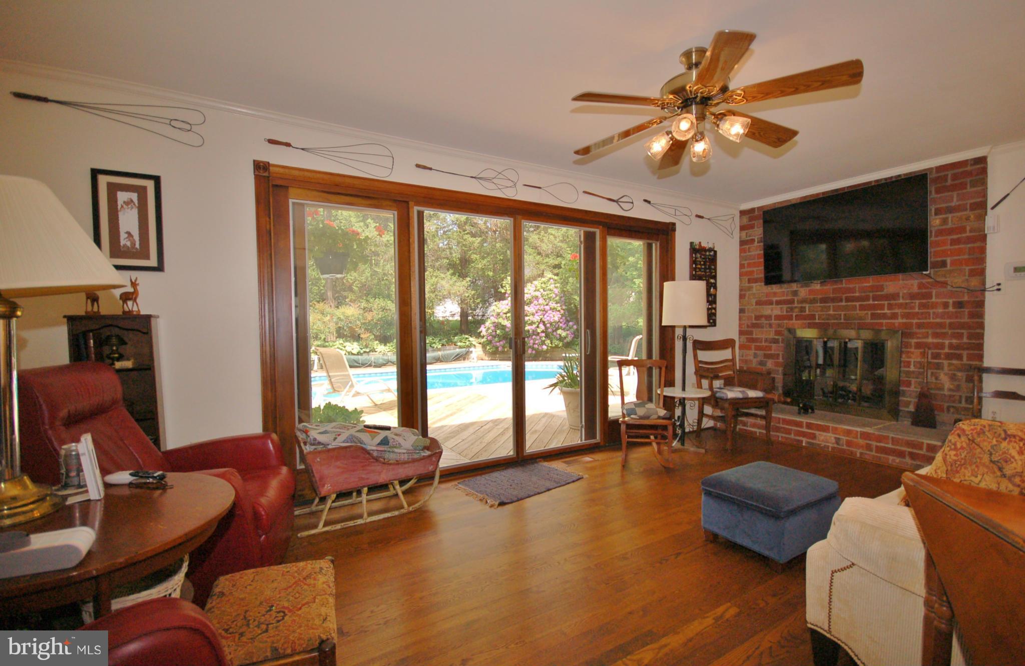 19104 Olney Mill Road Olney, MD 20832 - Photo 8 of 28 Family Room with fireplace, and sliders to deck