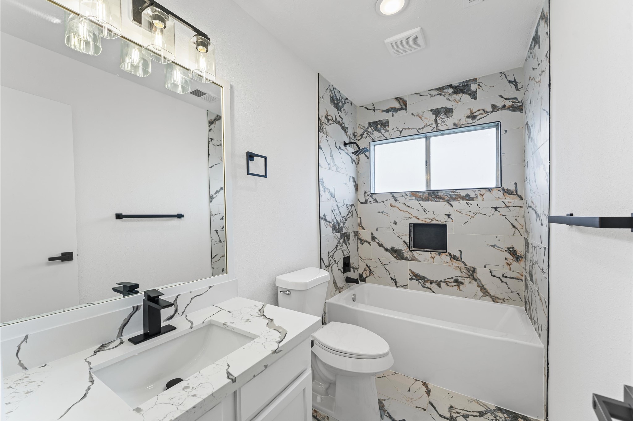 17527 Hamilwood Drive Cypress, TX 77433 - Photo 26 of 32 a bathroom with a sink toilet tub and shower