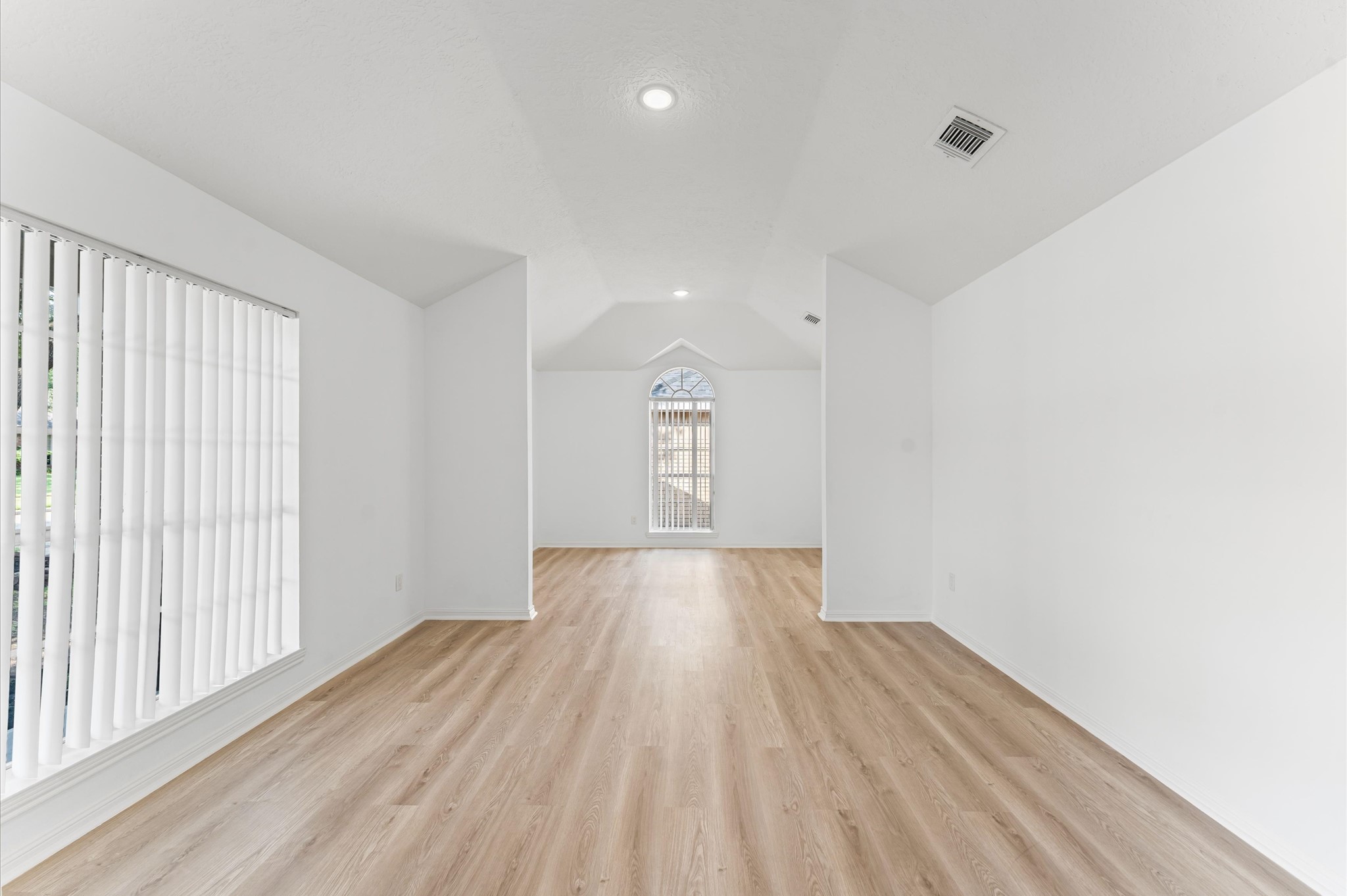 17527 Hamilwood Drive Cypress, TX 77433 - Photo 6 of 32 a view of empty room with wooden floor and fan