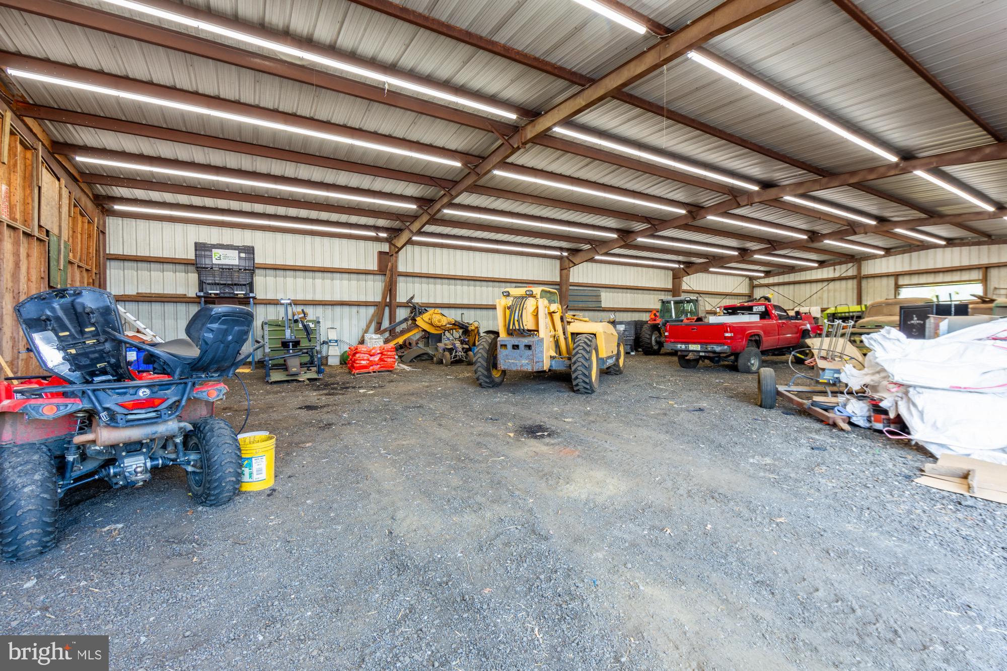 27058 Mt Pleasant Road Columbus, NJ 08022 - Photo 111 of 127 a view of parking garage with cars and other equipment