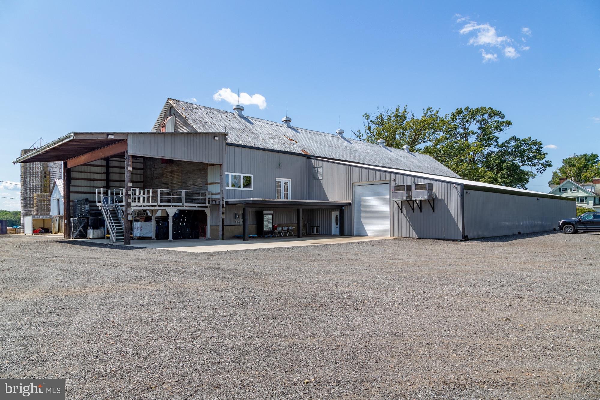27058 Mt Pleasant Road Columbus, NJ 08022 - Photo 38 of 127 a front view of a house with a yard and garage