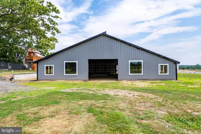 a view of large house with a yard