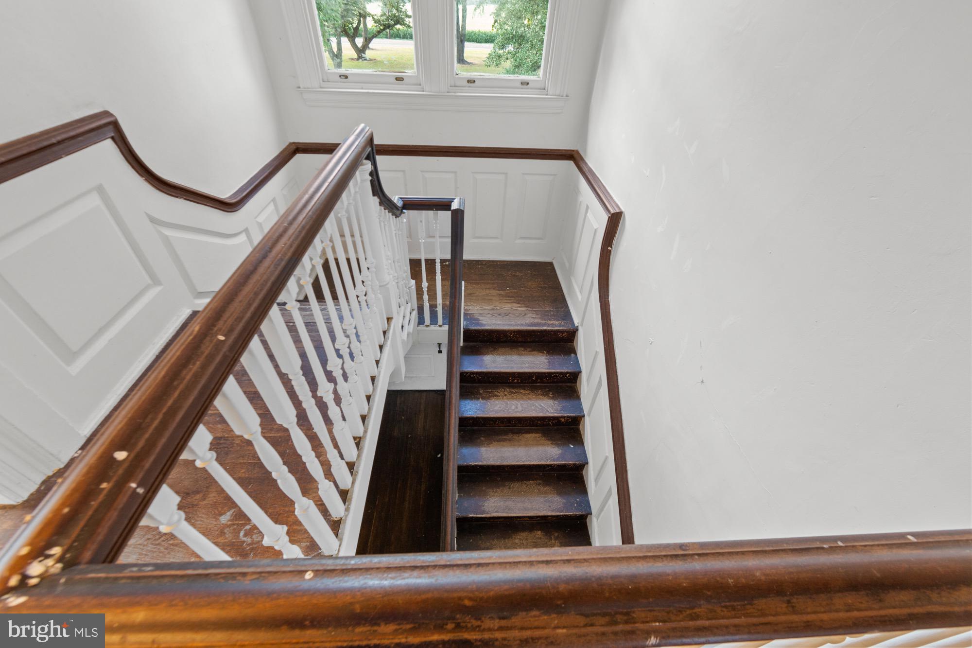 27058 Mt Pleasant Road Columbus, NJ 08022 - Photo 55 of 127 a view of staircase with wooden floor and white walls