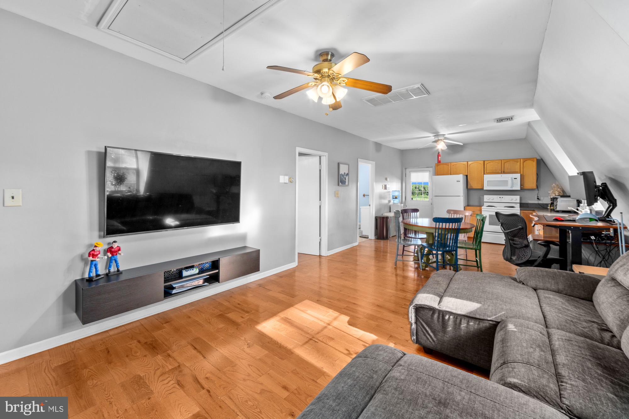 27058 Mt Pleasant Road Columbus, NJ 08022 - Photo 76 of 127 a living room with furniture and a flat screen tv