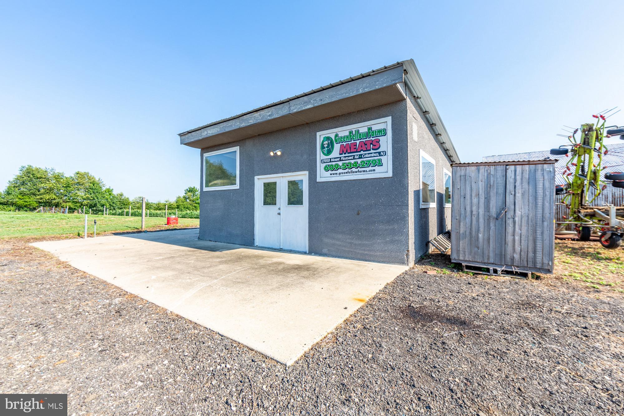 27058 Mt Pleasant Road Columbus, NJ 08022 - Photo 87 of 127 a front view of a house with a yard and garage