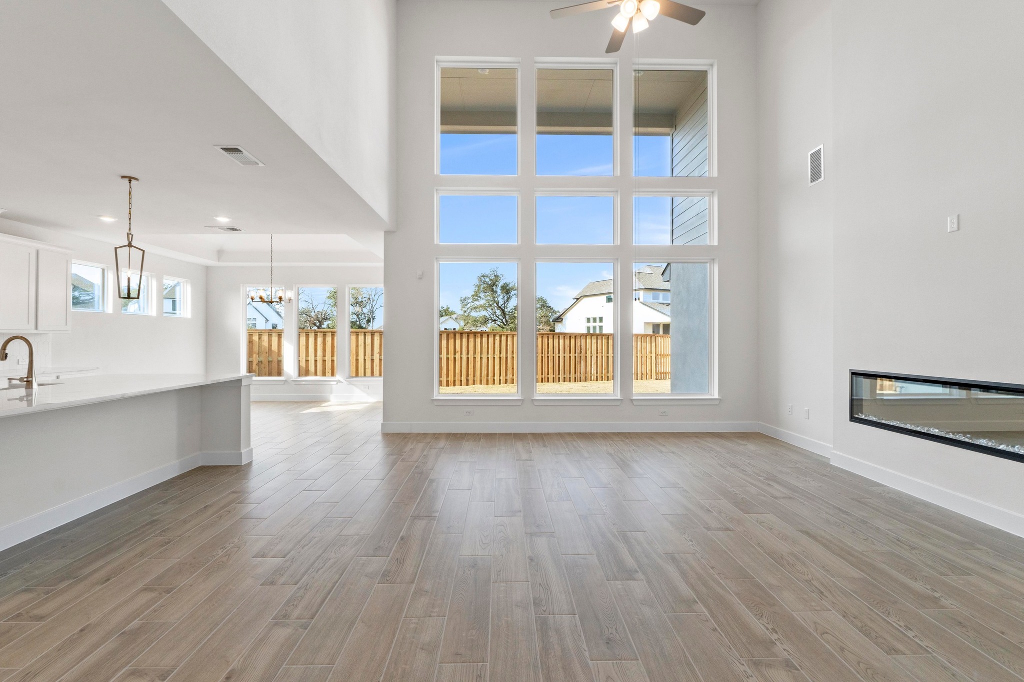 604 Lightstone Drive Georgetown, TX 78633 - Photo 3 of 39 a view of an empty room with wooden floor and a window