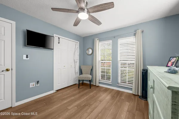 a view of livingroom with hardwood floor and workspace