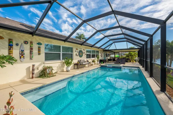 a view of swimming pool with a patio