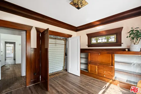 a view of front door with wooden floor