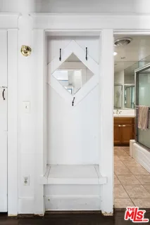 a view of entryway and hall with a bath tub
