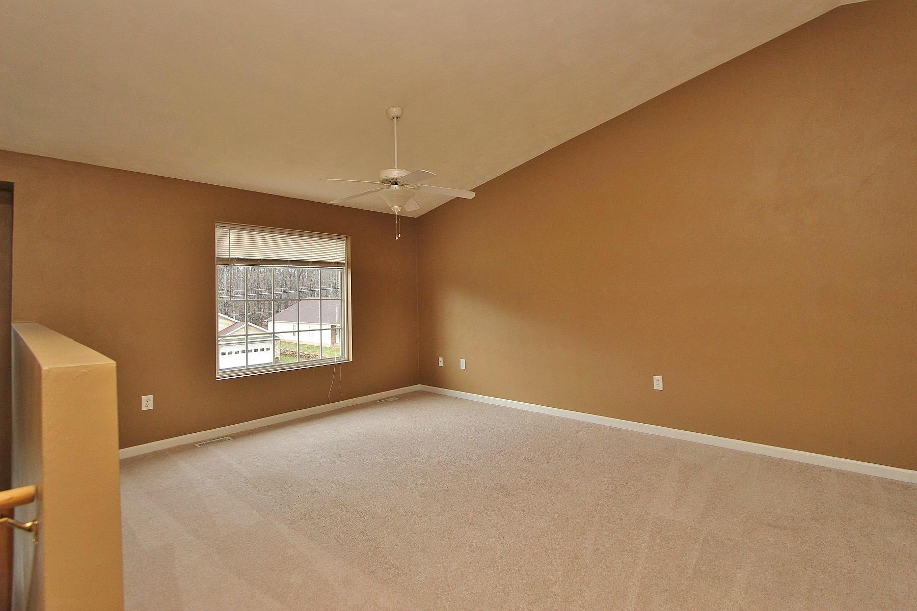 4239 Daugherty Road Salem, VA 24153 - Photo 3 of 38 a view of an empty room with windows