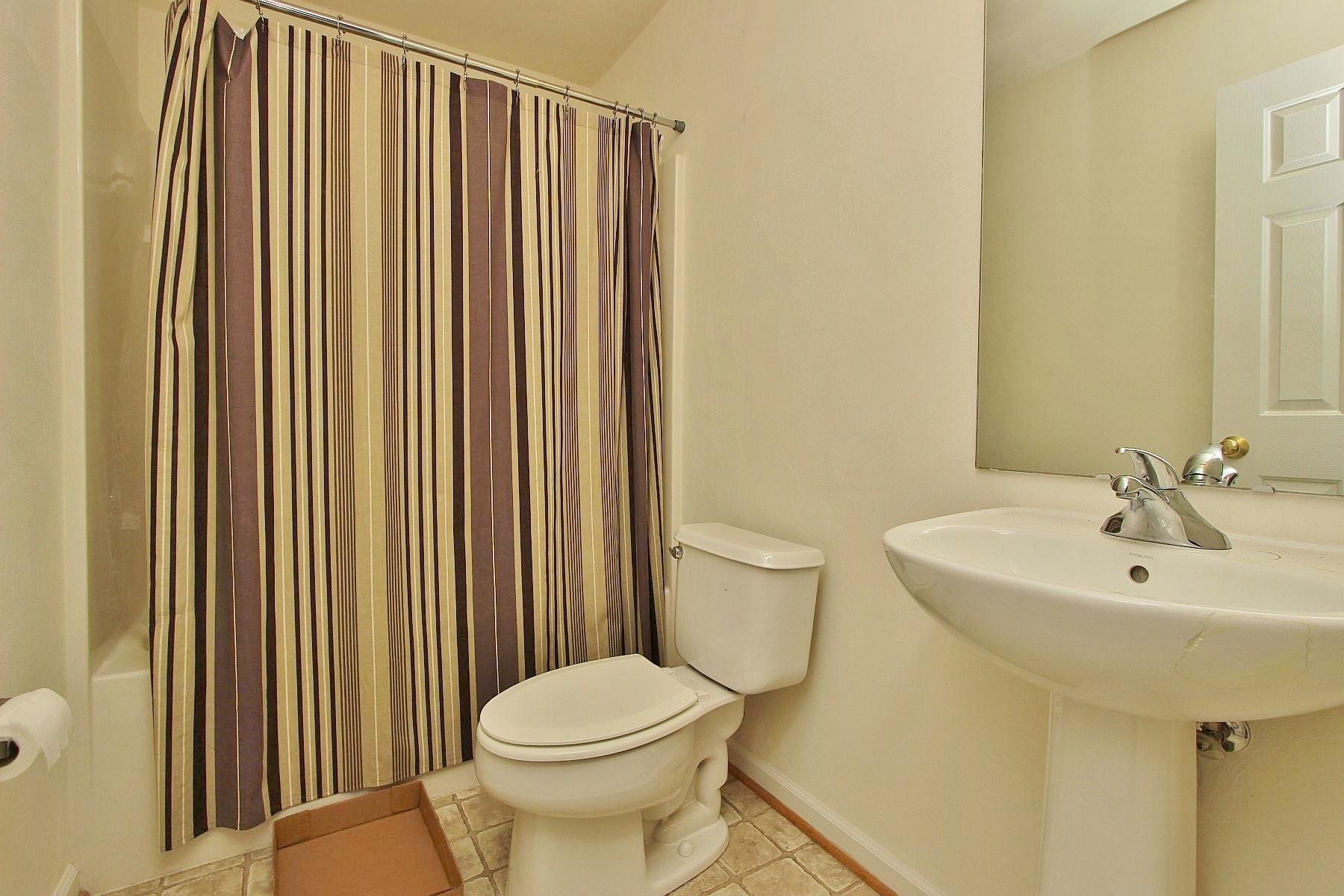 4239 Daugherty Road Salem, VA 24153 - Photo 30 of 38 a bathroom with a sink a toilet and mirror