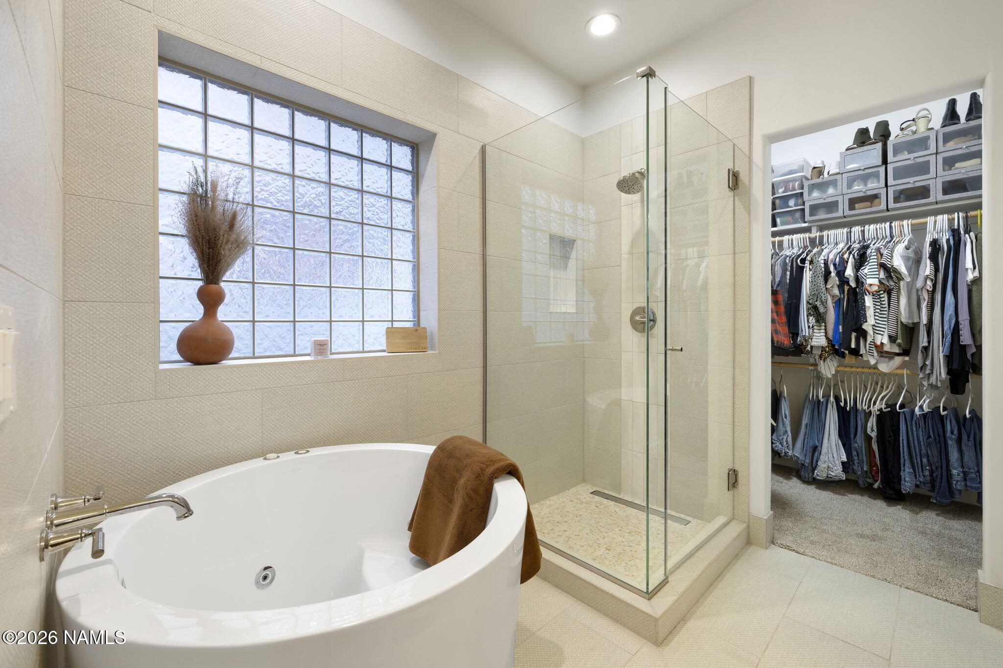 3495 West Lead Rope Flagstaff, AZ 86005 - Photo 25 of 49 a bathroom with a bathtub and a shower