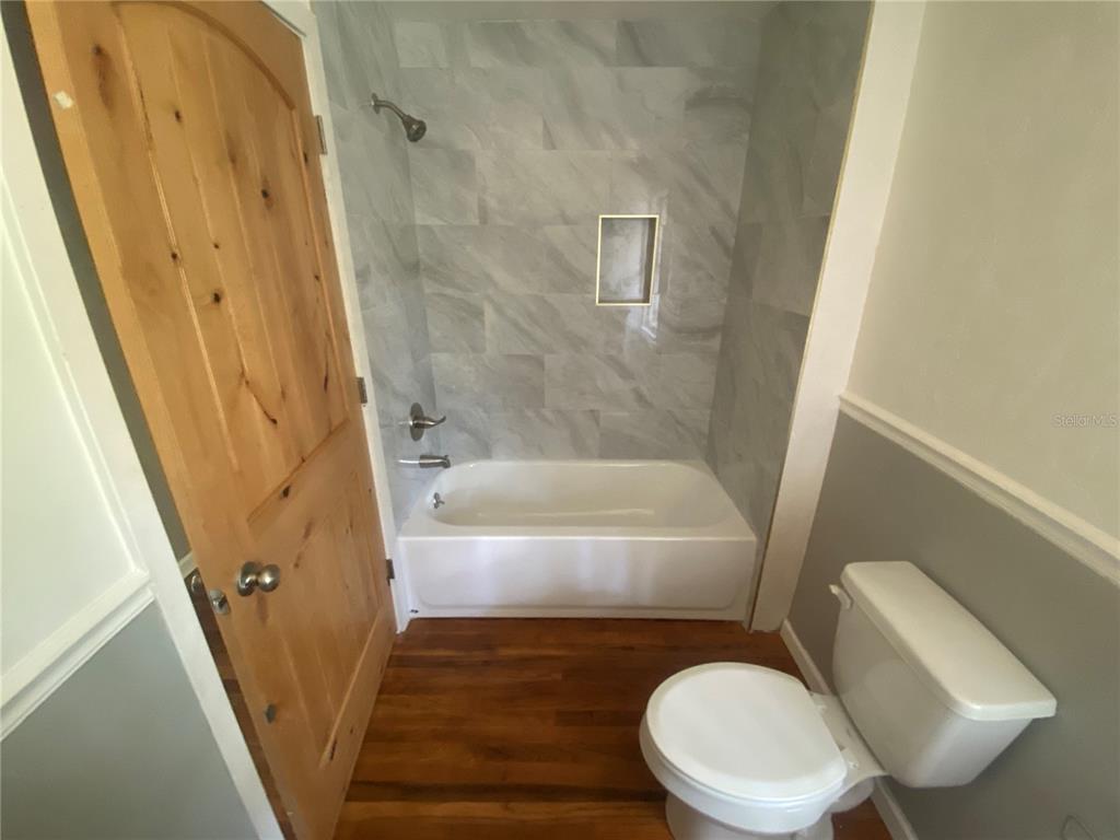 3023 Southeast 13th Place Gainesville, FL 32641 - Photo 12 of 29 a bathroom with a sink and a bathtub