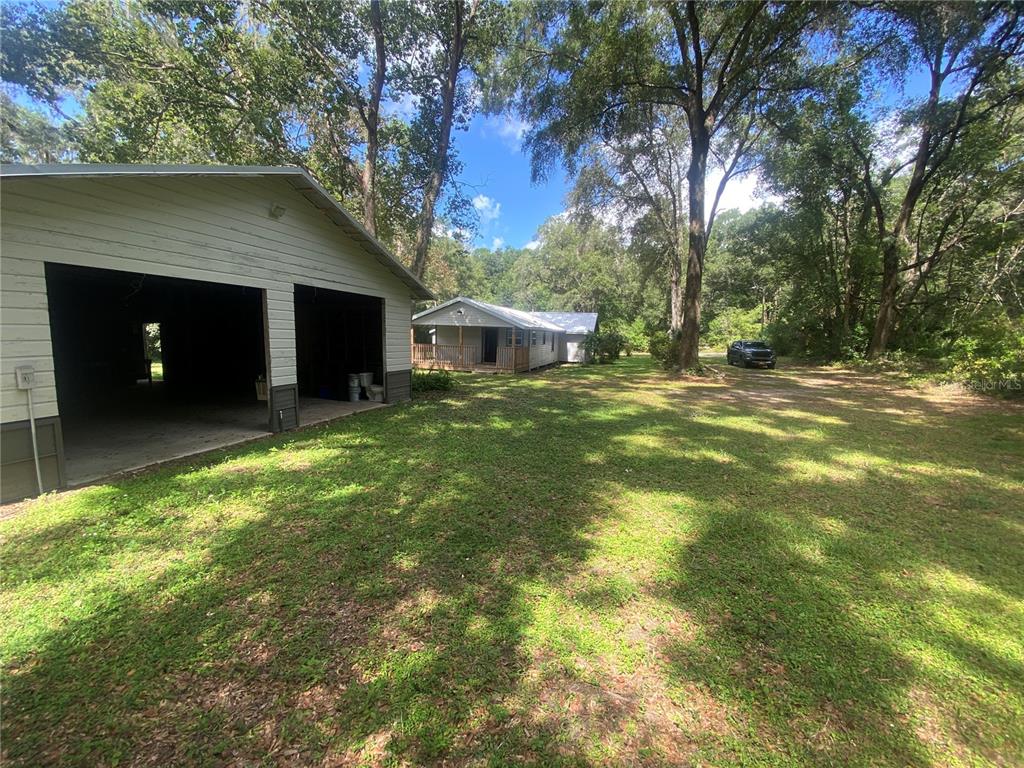 3023 Southeast 13th Place Gainesville, FL 32641 - Photo 28 of 29 a house view with a garden space