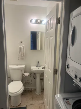 a view of a livingroom with wooden floor and windows