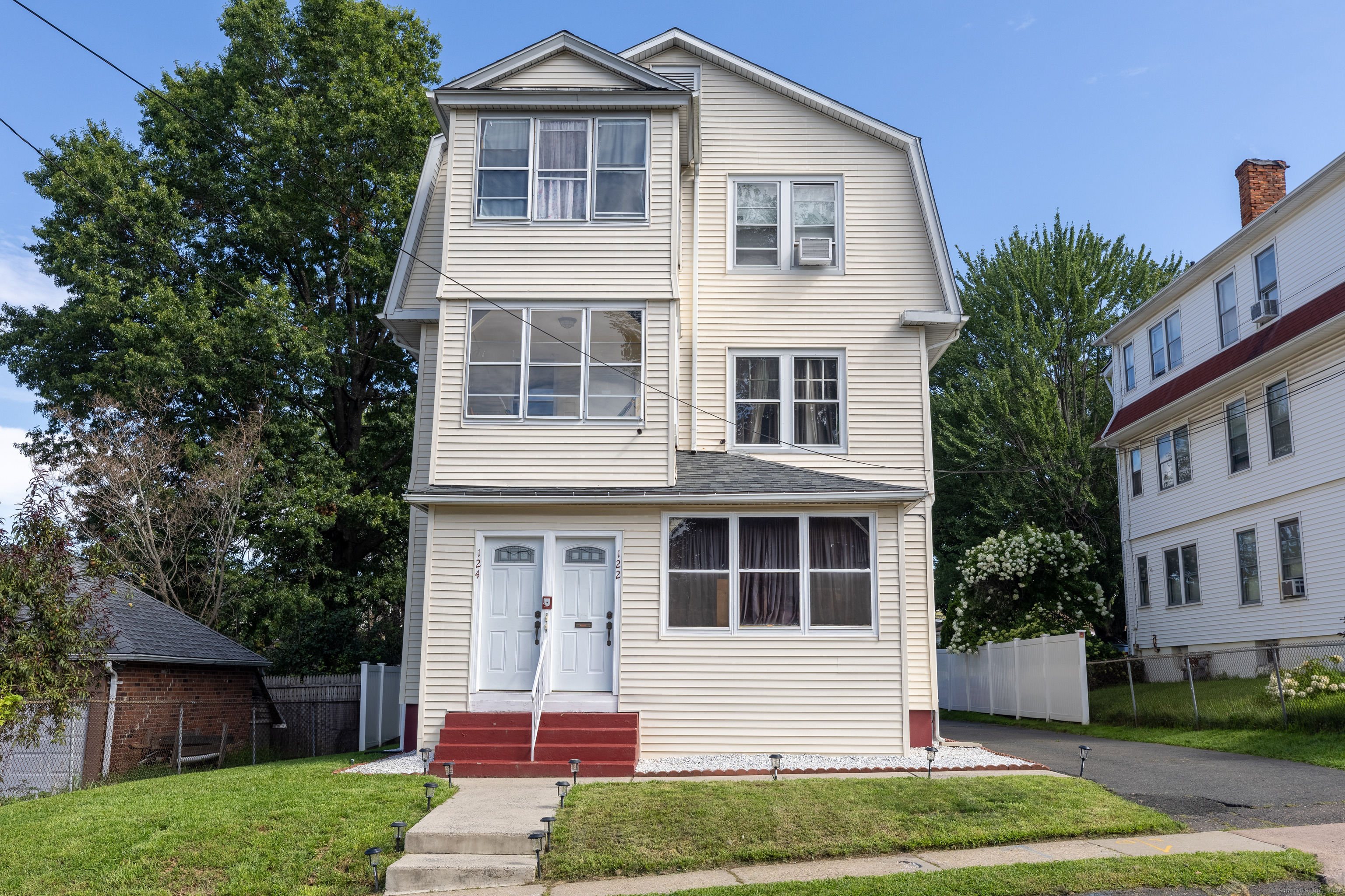 122 Arnold Street Hartford, CT 06106 - Photo 1 of 1 a front view of a house with a yard