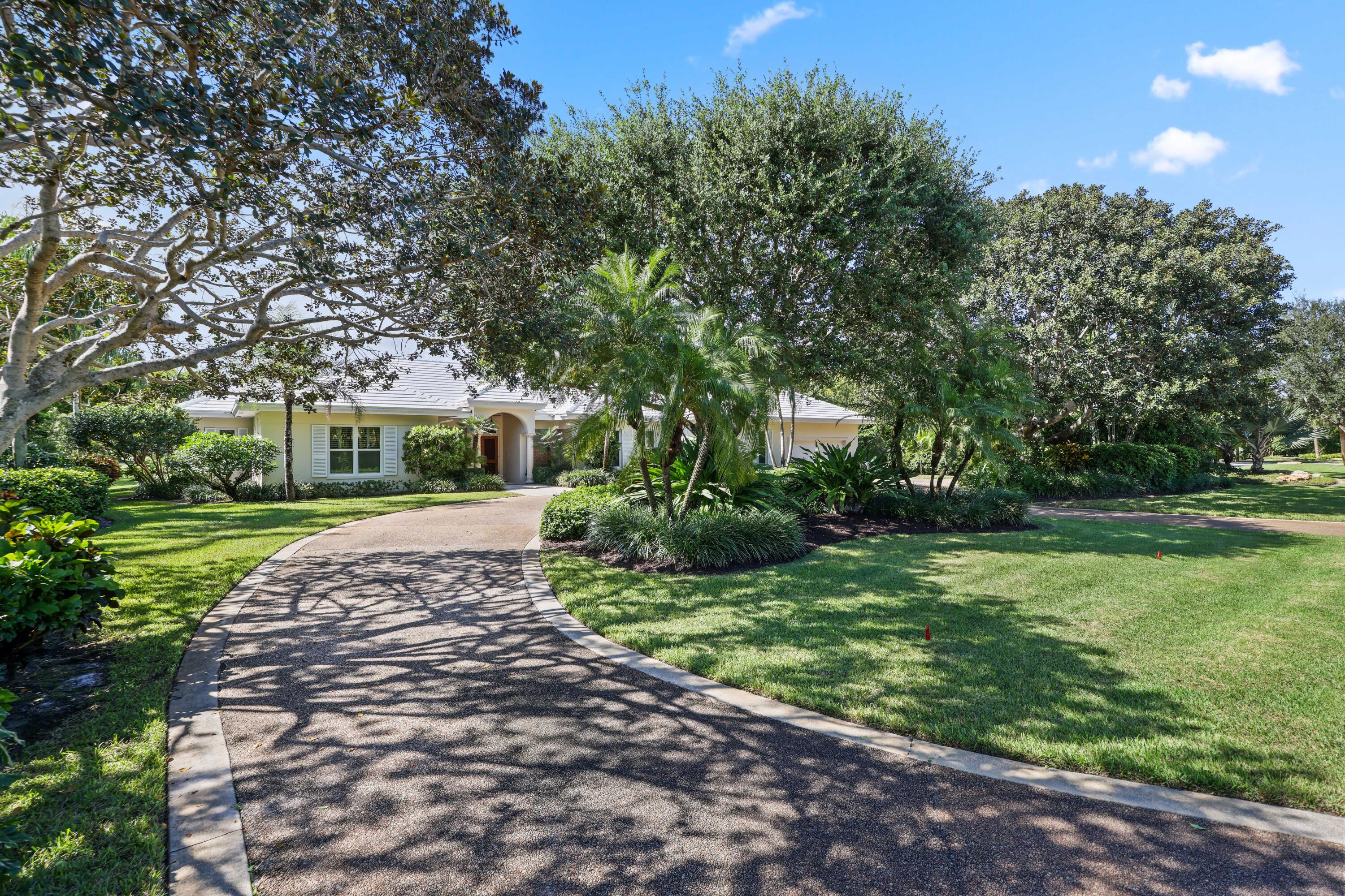 5 Country Road East, Unit A Boynton Beach, FL 33436 - Photo 2 of 51 a view of a house with a yard