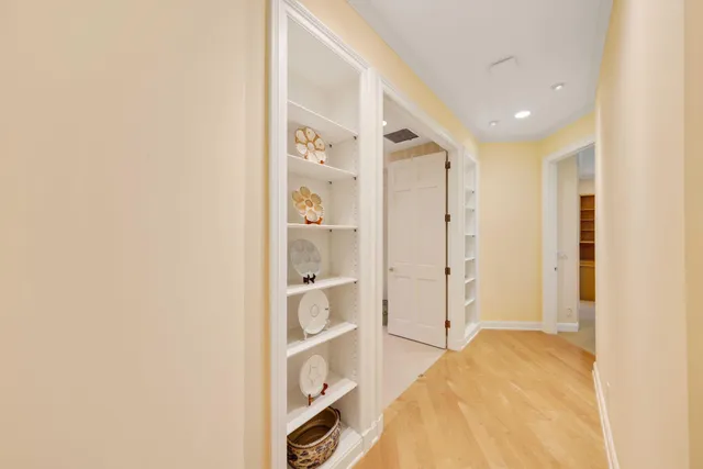 a spacious bedroom with a bed and a shower